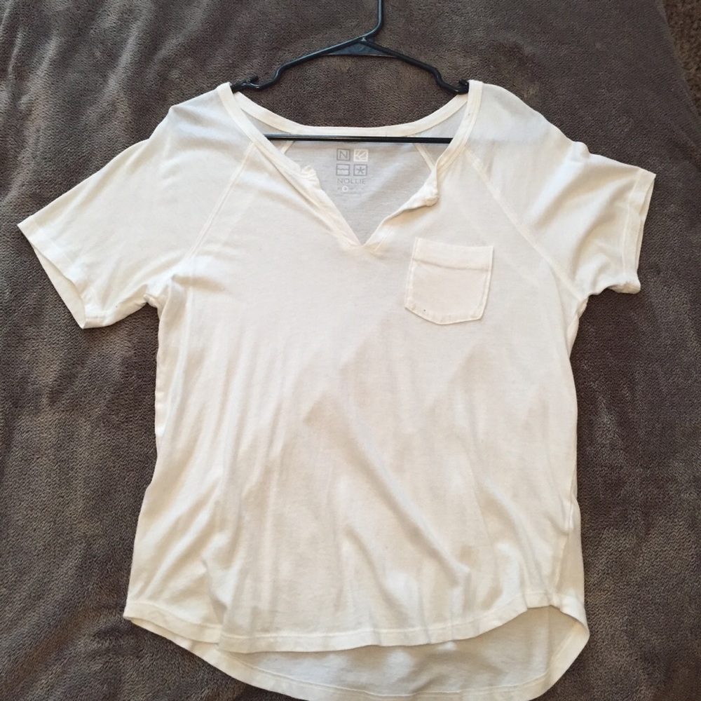 Plain white tee with a front pocket and v-neck.